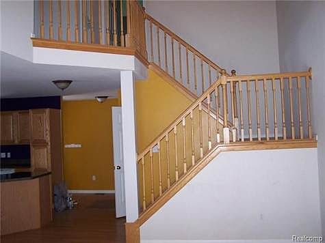 vaulted ceiling and staircase