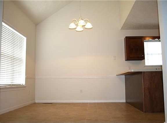 Vaulted ceilings in Eat-In Kitchen Area. Room for large table and bar stools!