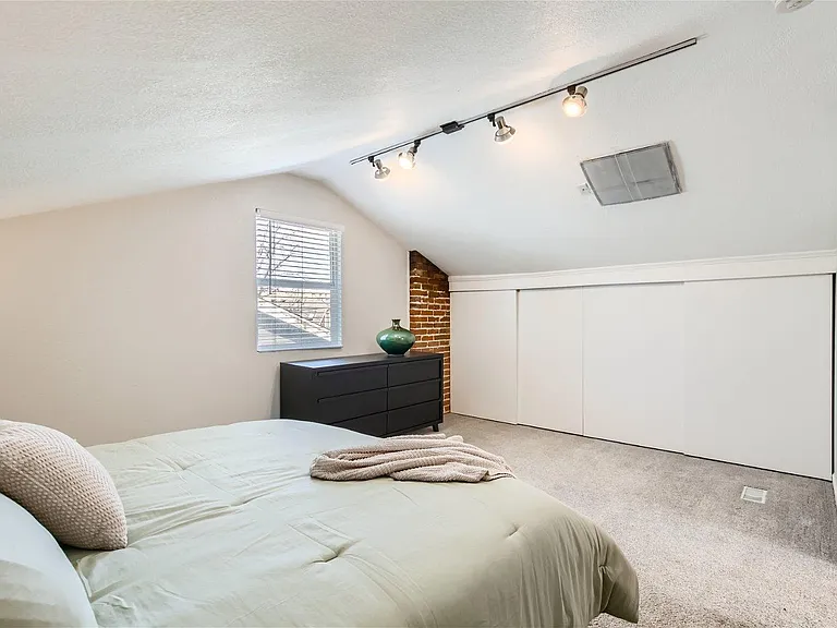 Master bedroom, ensuite bath, king bed, larger closets.