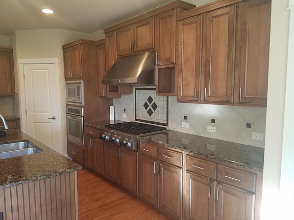 Kitchen with Stainless steel applicances and granite counter