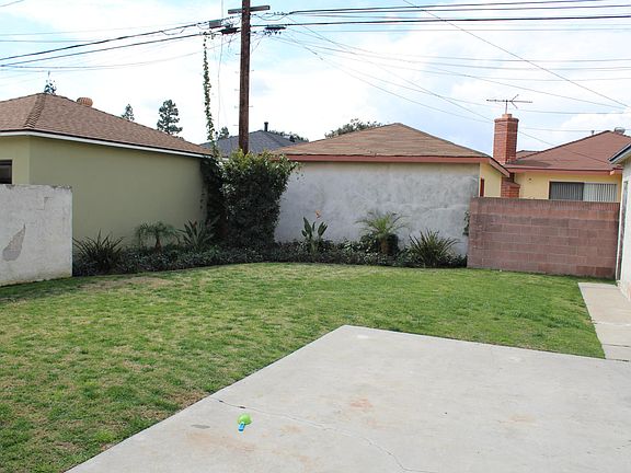 Large yard and concrete patio.