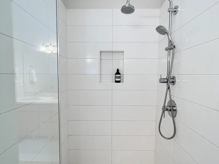 Rain shower with custom glass door and designer tiles