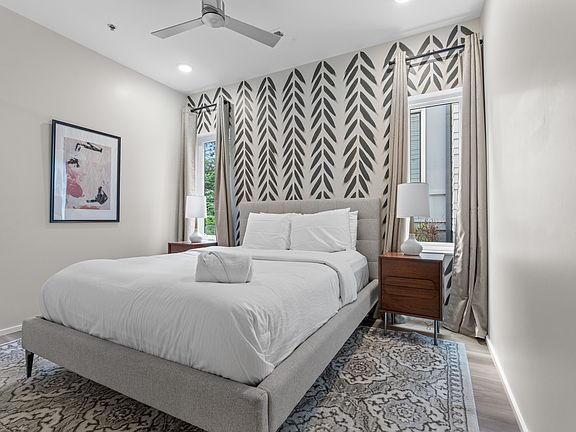 secondary bedroom: staged similar unit. This one is NOT furnished.