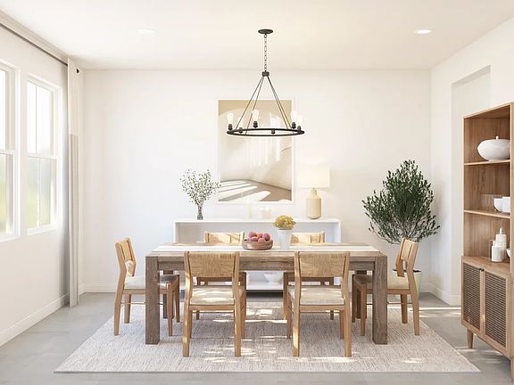 Dining room with chandelier off foyer