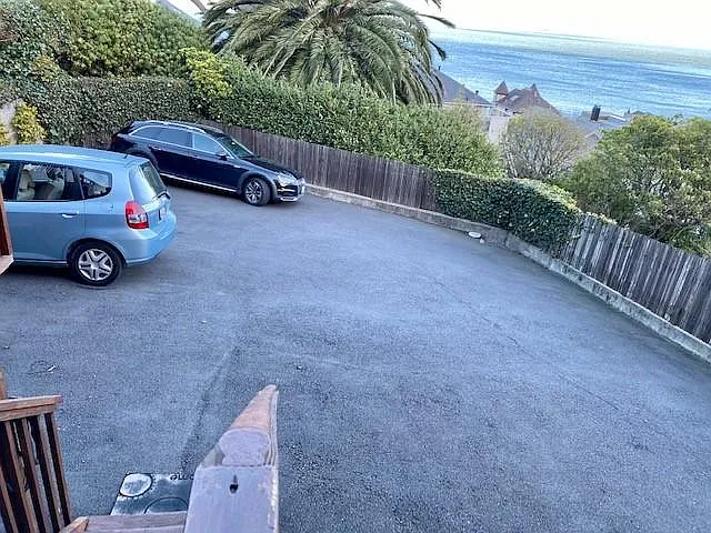 Parking area for one car at rear of house