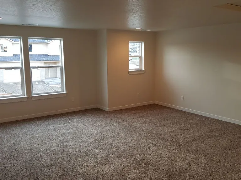 Bonus room (upstairs); photo taken while the opposite house was under construction