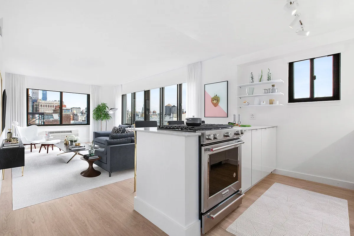 Stainless steel appliances and white cabinets - The Chelsea