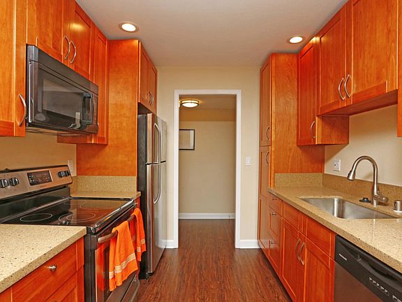 Updated kitchen with granite countertops and stainless steel appliances