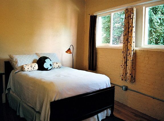 Bedroom is tucked away; windows face west