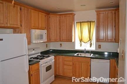 eat in kitchen with 42" cabinets : refrigerator, dishwasher microwave and stove included ceiling fan