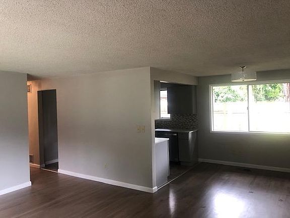 Living room view of Dining area and Kitchen.