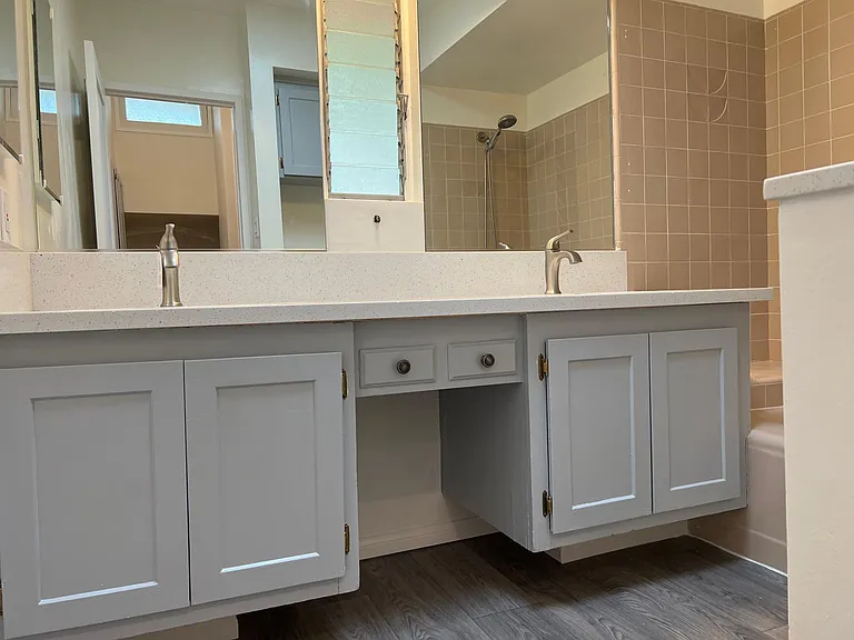 Bathroom with duel sinks and quartz countertops