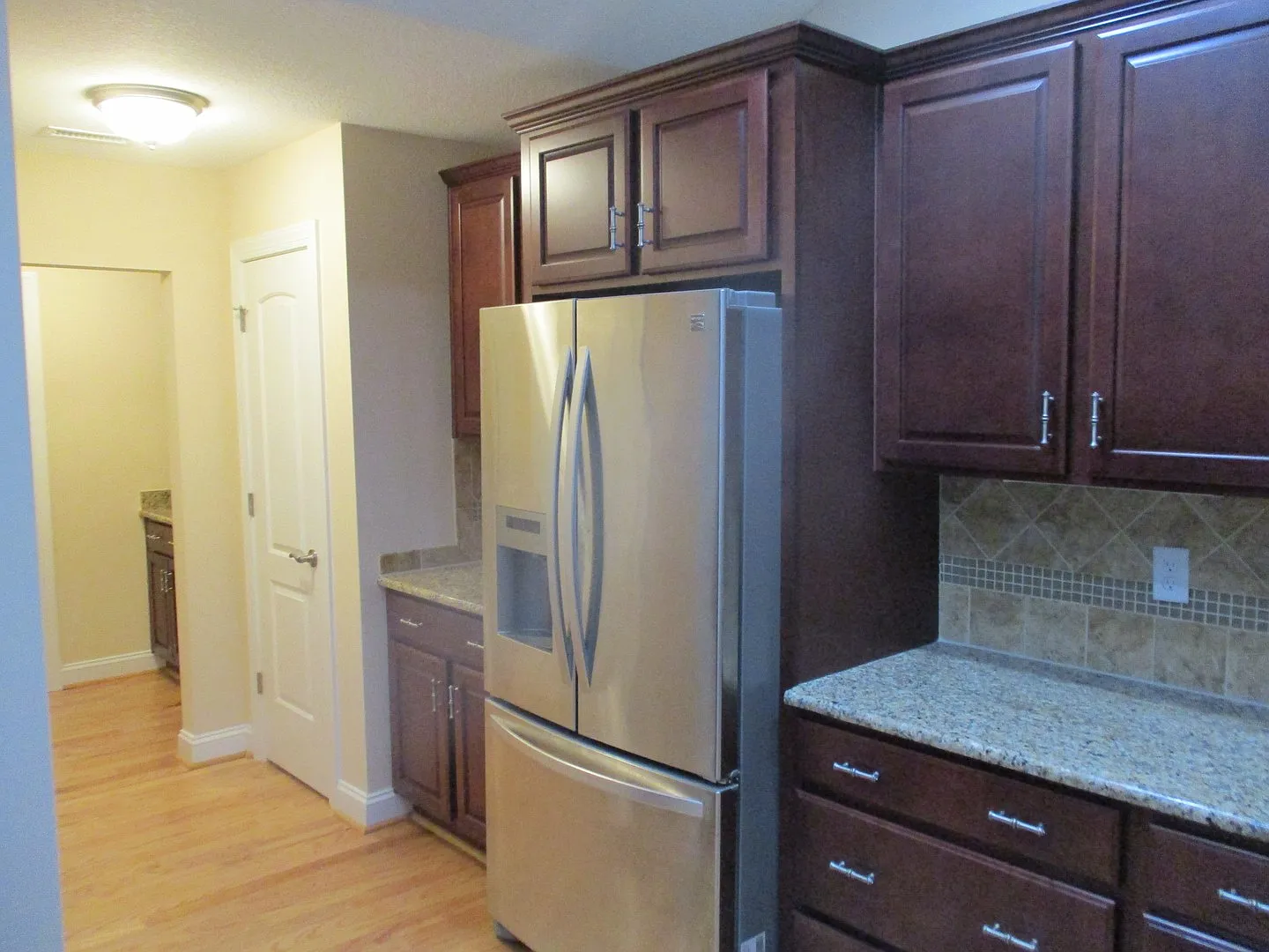 One floor living in 55+ community with a 2-car garage — Photo 1