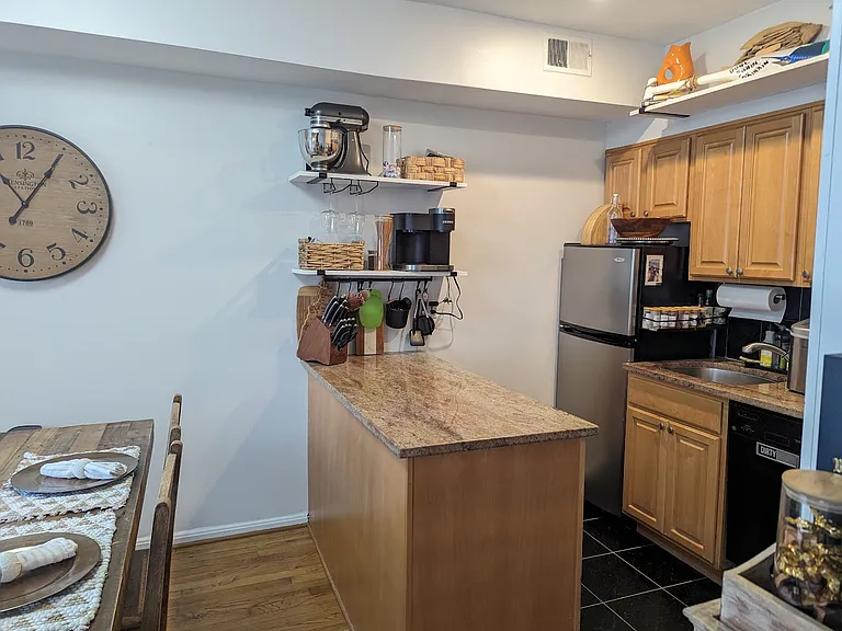 Kitchen island providing additional counter top space and storage