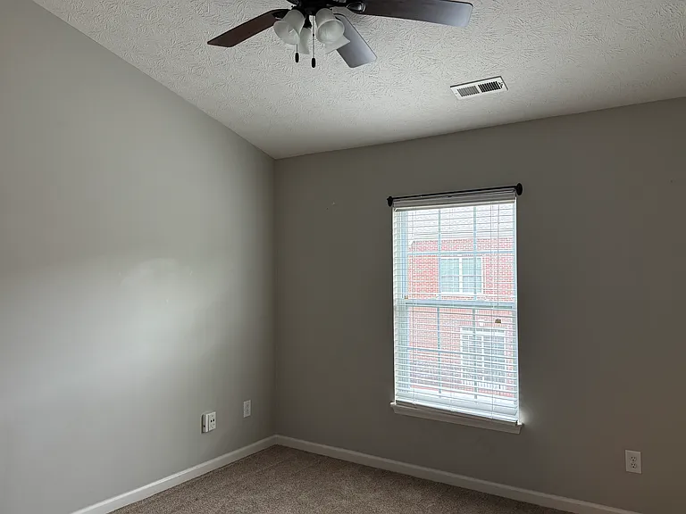 The first of three upstairs bedrooms.