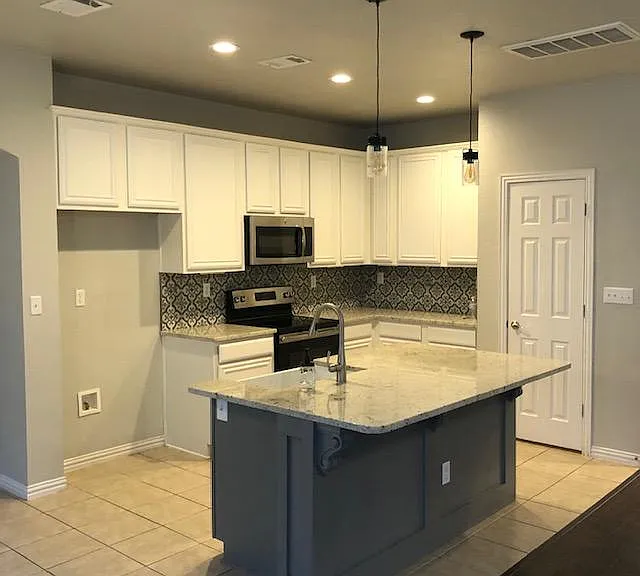 Stainless steel appliances, with granite counter tops and custom sink make this a perfect place to have fun preparing meals and entertaining guests.