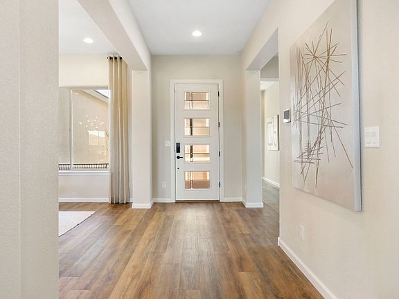 The foyer of the Patagonia is elegant and bright with a glass paneled front door.