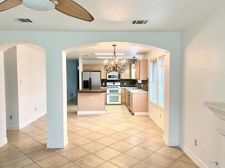 View of kitchen open to family room. Kitchen has double oven for those who love to cook!