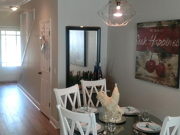 Dining room open to the kitchen and living room. Tons of natural light. Laminate scratch proof flooring for easy clean up and high traffic.