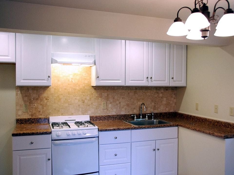 Open floor plan with kitchen next to living room