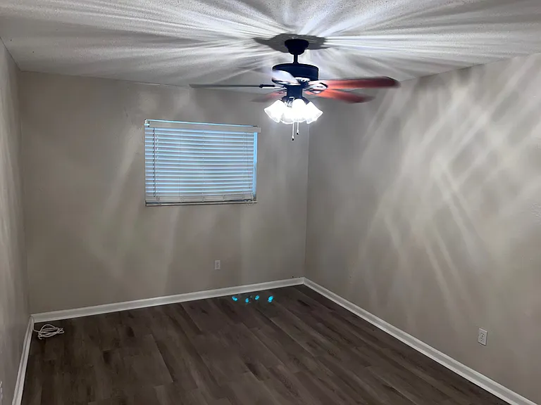 Large room at the end of the hallway. (View 1)