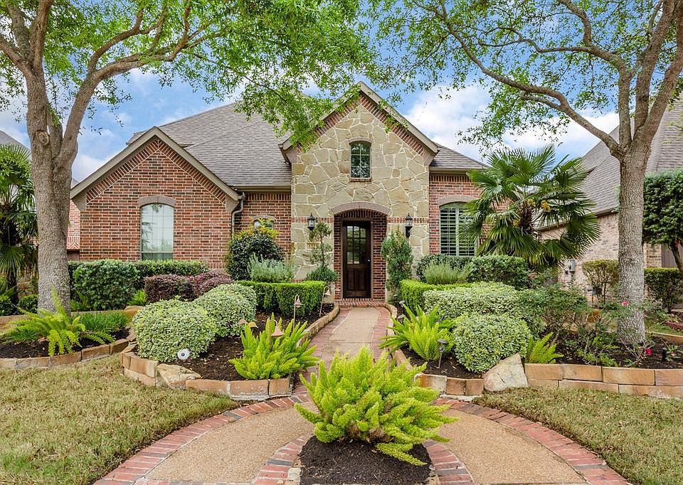 If you are unable to tour this home, please let us know! We are happy to give you a private tour via Facetime/Whattsapp! This home will WOW you from the moment you arrive! From the beautiful brick and stone elevation, to the mature landscaping, this 