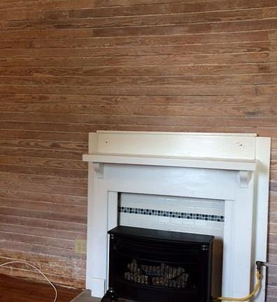 Fireplace and old wooden antiqued walls