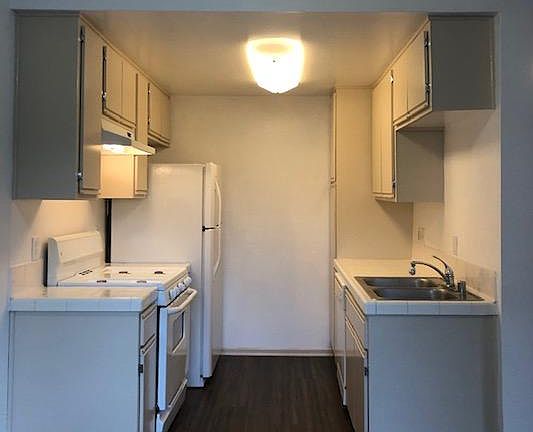 Kitchen has newer appliances and plenty of storage.