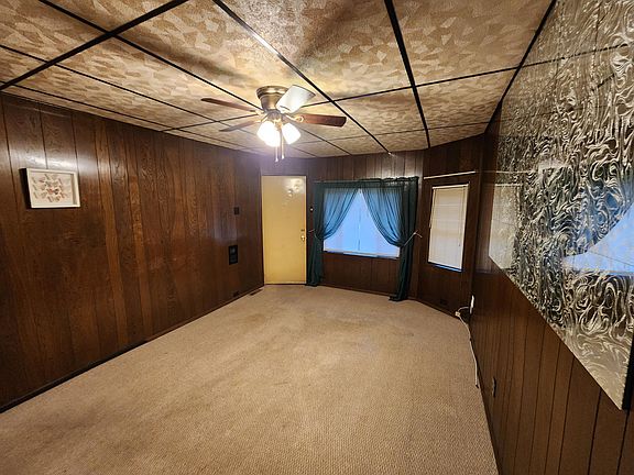 living room with fan.