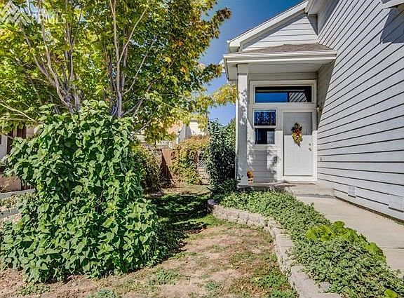 Tucked back and treed front porch will welcome your friends and family.