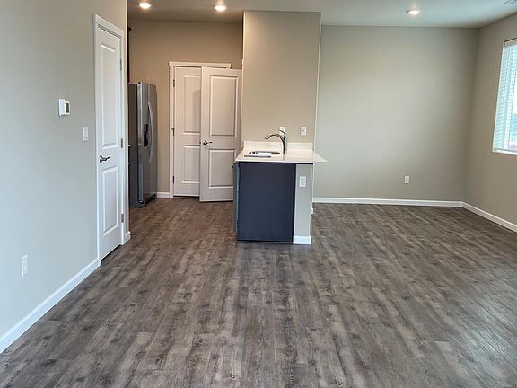 Open concept living, dining and kitchen area