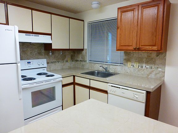 Beautiful tile backsplash behind granite counters for the updated kitchen. Window above your sink!