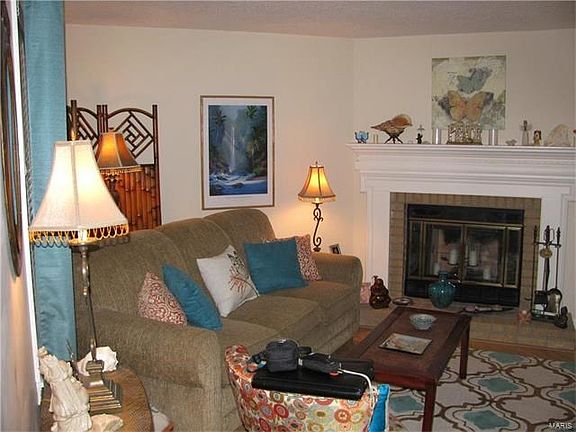 Beautiful family room with wood burning fireplace.