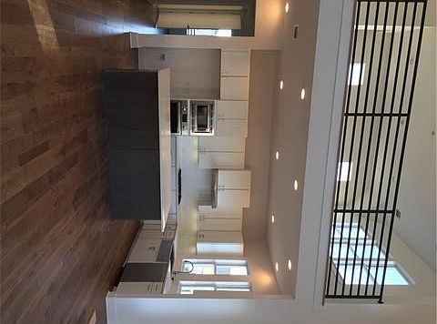 Kitchen with game room above