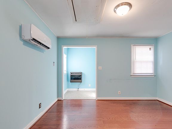Living room with front foyer in background