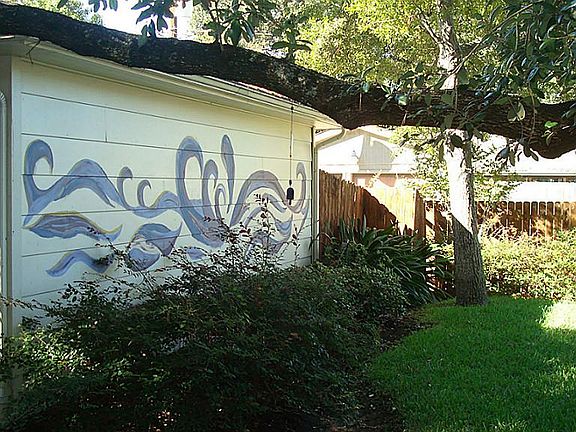 Enjoy the artistic touches on the garage.