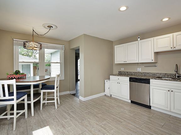 Neutral eat-in kitchen flows right into the family