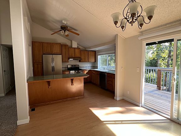 Spacious kitchen and dining room overlooking greenbelt.