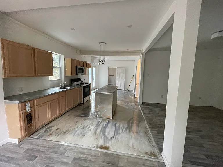 Kitchen view open concept can see kitchen living room & dining room bathroom just ahead of you also