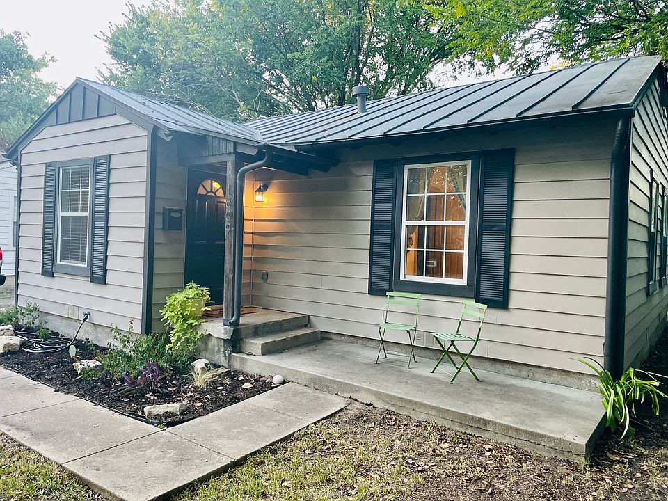 Inviting front door and cozy porch area, offering a warm welcome home!