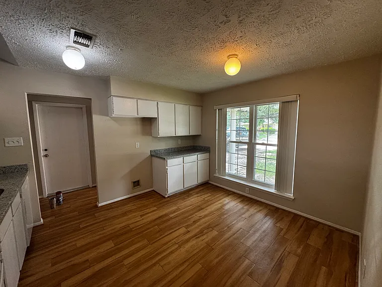 Kitchen, new paint on cabinets and new granite countertops.