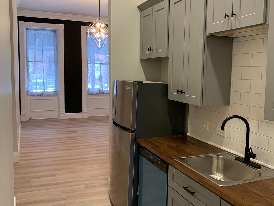 Fully Renovated Kitchen, with backsplash. Notice the crown molding and beautiful trim.