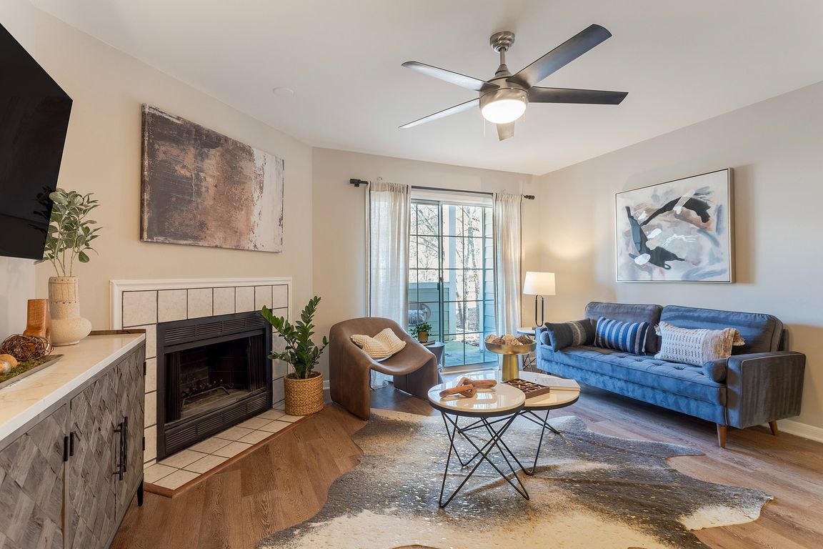 Newly Renovated Living Room with Hardwood-Style Flooring