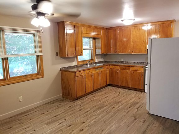 New kitchen countertop, sink and fixtures can be seen in this view.