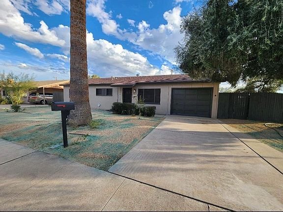 Driveway with 1 car garage. (blue stuff is not there any more, the pic was taken after spraying for weeds).