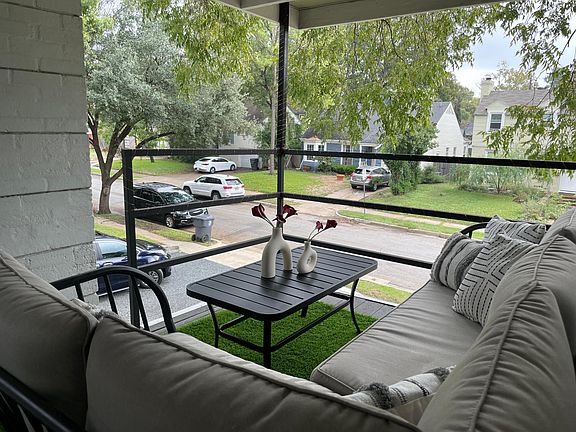 Covered balcony with fan just off upstairs primary bedroom.