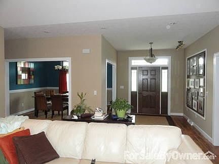 Foyer/Dining
						:
						Hardwood floors throughout foyer and dining room, chair rail in dining room