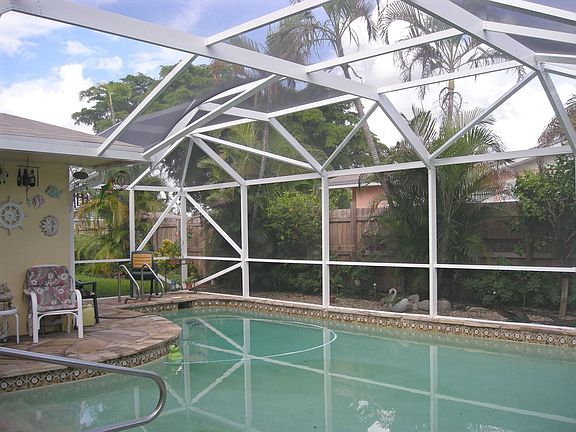 Dome screened pool area with flagstone deck