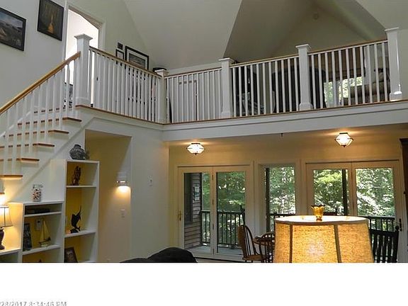 Strikingly beautiful Great Room with 34' vaulted ceiling, two skylights, double ceiling fans, gas fireplace, heat pump for cooling, convenient built-in bookcases & display shelving. Versatile, open & sunny floor plan takes full advantage of the quiet priv
