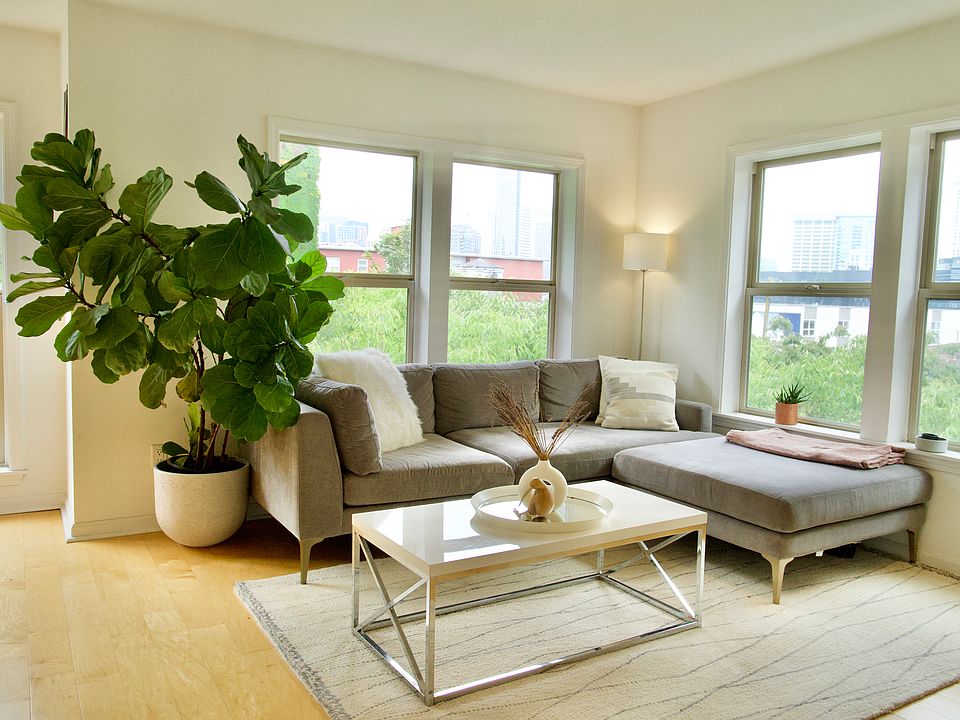 Living room with south and west facing windows, overlooking downtown Seattle